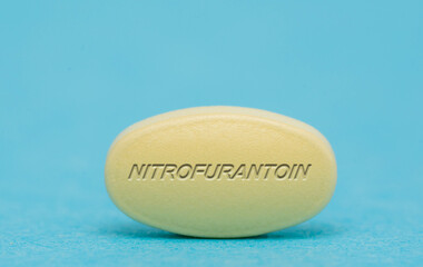 Obraz na płótnie Canvas Nitrofurantoin Pharmaceutical medicine pills tablet Copy space. Medical concepts.