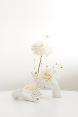 Light wedding original compositions with large light flowers and white hands