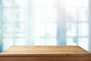 Empty wooden  table over window blurred  background. Kitchen interior mock up for design and product display