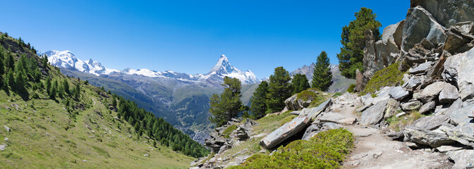 The panorama of swiss walliser alps with the Matterhorn peak over the Mattertal valley.