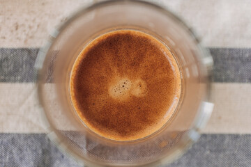 Above view of homemade coffee with milk and beautiful crema.