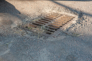 catch basin grate of the lattice of the drain system for drainage of rainwater from the road...