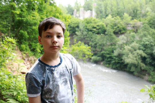 Portrait of boy on bank of Belaya River