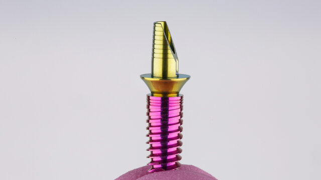 Dental Implant With Abutment And Base For A Crown On A White Background