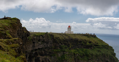 Fototapeta na wymiar Iceland Lighthouse with cliffs 