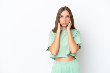 Young Lithuanian woman isolated on white background frustrated and covering ears