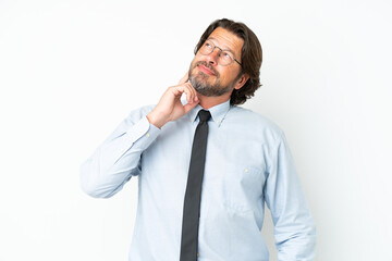 Senior dutch business man isolated on white background thinking an idea while looking up