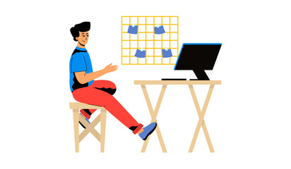 A man is sitting at his desk. A man in the workplace, a computer desk at home. The concept of remote work, training, self-education