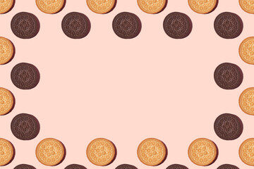 cookie frame. Cookies on a pink background. Flat lay. Sweet cookies flat lay pattern on light pink background. Top view.