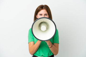 Young English woman isolated on white background shouting through a megaphone to announce something