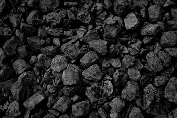 A heap of black natural coal, photo of coal mine background, texture