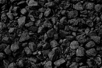A heap of black natural coal, photo of coal mine background, texture