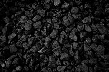 A heap of black natural coal, photo of coal mine background, texture