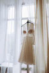 wedding dress on a window