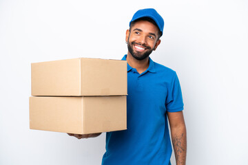 Delivery Brazilian man isolated on white background thinking an idea while looking up