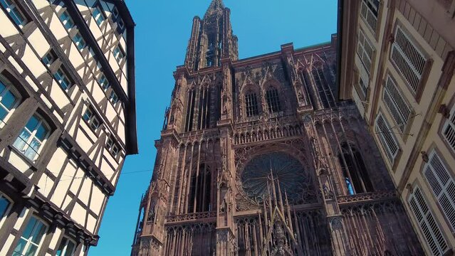 A sunny day around the cathedral in  Strasbourg France panning around.