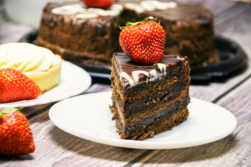 Still life with chocolate cake and strawberries.