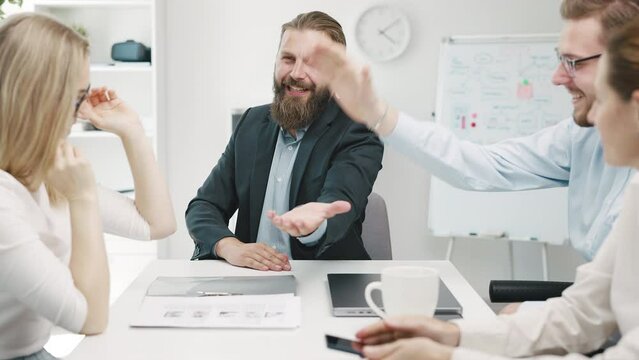 Team of mature coworkers in the office giving five by hands gesture, teamwork motivation, partnership concept