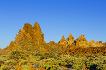 The volcanic rock formations of 'Los Roques de Garcia' in the caldera of the El Teide strato volcano in early morning light, UNESCO World Heritage Site, Tenerife, Spain