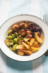 Chicken meatballs with roasted potatoes with brussel sprouts and cabbage 