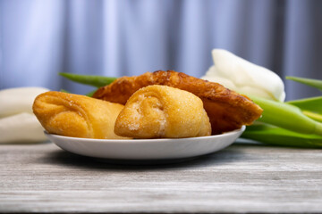 delicious puff and shortbread cakes with white flowers