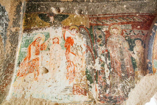 Old frescoes on wall of Three Crosses church