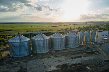 Aerial view of industrial ventilated silos for long term storage of grain and oilseed. Metal...