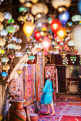 Beautiful woman surrounded by colorful lanterns