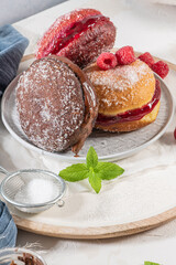 Bolas de Berlim, or Berlin Balls. Portuguese fried dough with sugar, Filled with chocolate or raspberry jam. Portuguese fried dough with sugar.
