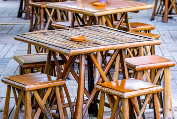 table and chairs at a sidewalk cafe