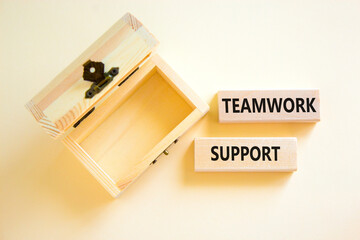 Teamwork support symbol. Concept words Teamwork support on wooden blocks on a beautiful white table white background. Empty wooden chest. Business and teamwork support concept. Copy space.