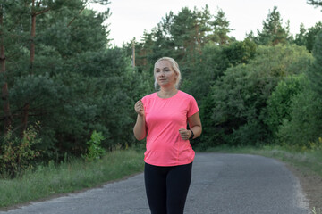 a young girl runs in the woods Doing sports Healthy lifestyle