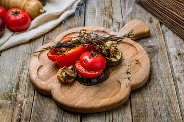 grilled vegetables on a board on wooden table