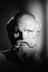 statue of a person with a skull