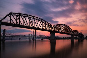 The Big Four Bridge that connected Kentucky and Indiana is an old railroad truss bridge, originally built in 1895, and was converted into a path for people to walk, run and bike across the Ohio River. - obrazy, fototapety, plakaty