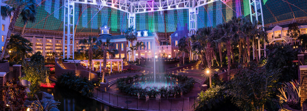 NASHVILLE, TN, USA - February 27, 2018: At night the Gaylord Opryland Resort & Convention Center has a fascinating light show with their fountains and dangling led lights in the middle of the atrium. 