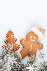 Gingerbread man, cookies and Christmas decor on pastel background. - 524738507
