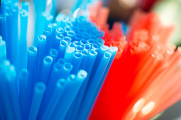 Red and blue plastic straws.