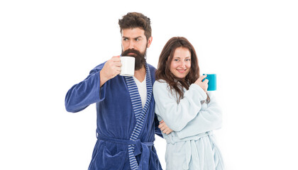 With coffee morning tastes better. Couple relax in morning with coffee. Couple enjoy lazy weekend and drink coffee. Man and woman wear bathrobes hold tea mug or coffee cup. Caffeine power concept - Powered by Adobe