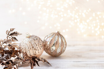 Golden christmas balls with bokeh.