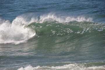 wave known as shorebreak at post six on Copacabana Beach in Rio de Janeiro, Brazil.