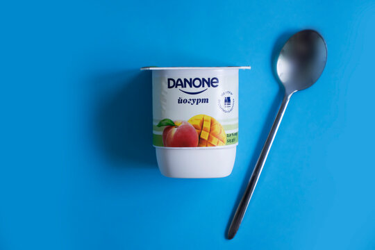 August 20, 2022 Ukraine Kyiv city Danone yogurt on a colored background