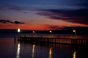 Fototapeta na wymiar Sunset on lake Trasimeno from Passignano, Italy 