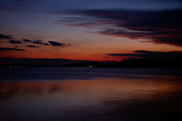 Fototapeta na wymiar Sunset on lake Trasimeno from Passignano, Italy