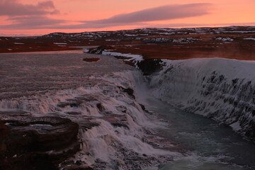 sunrise over the falls and cliffs