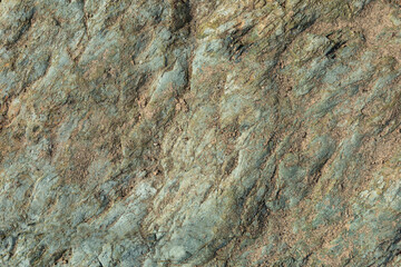 Background of blue-green rock and sand