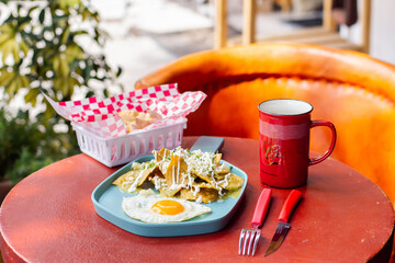  chilaquiles with sunny side up egg and coffee