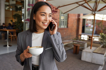 Smiling confident young adult Asian business woman professional manager, businesswoman executive...