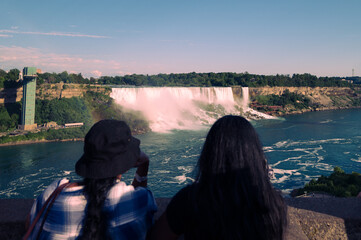 Two girls in foreground of  Niagara Fall