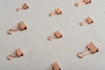 Golden paper binder clips pattern